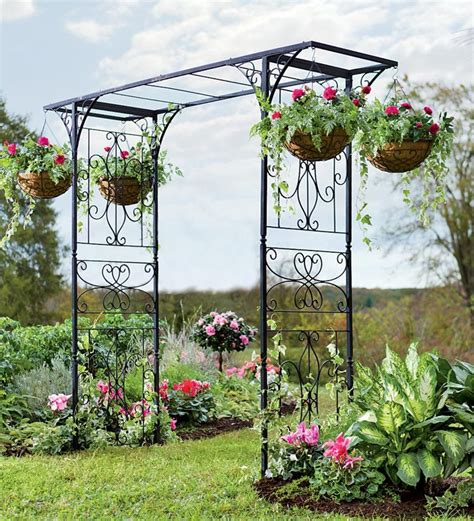 metal arbor with planter boxes|outdoor planter with privacy trellis.